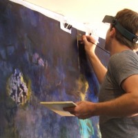Tim Neill working on a painting on canvas